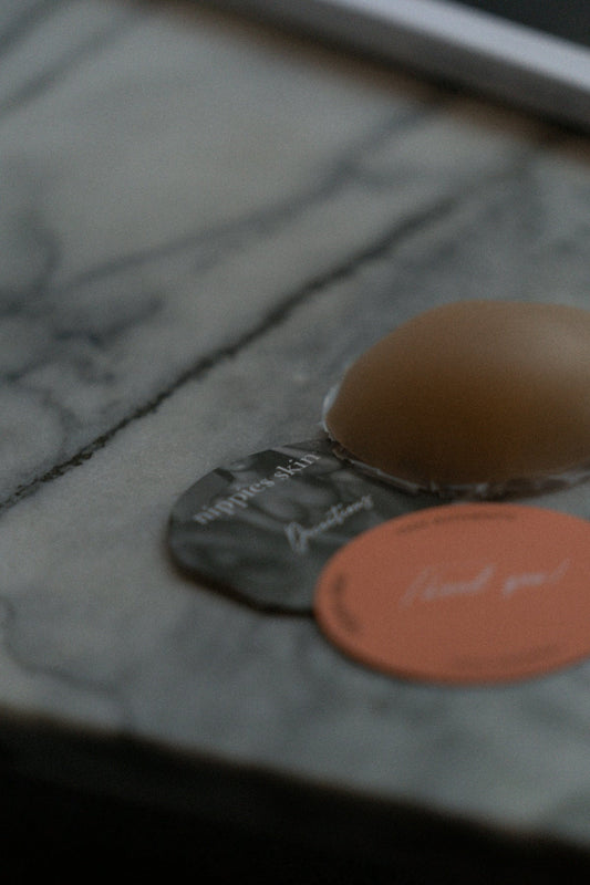 a pair of orange and black slippers on a white surface