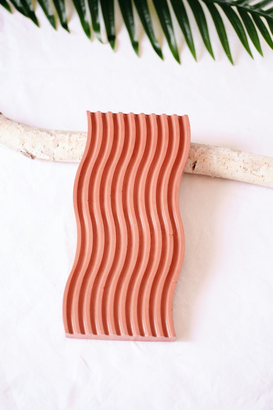 Modern terracotta tray with wavy design inspired by eco-friendly home decor ideas and natural elements