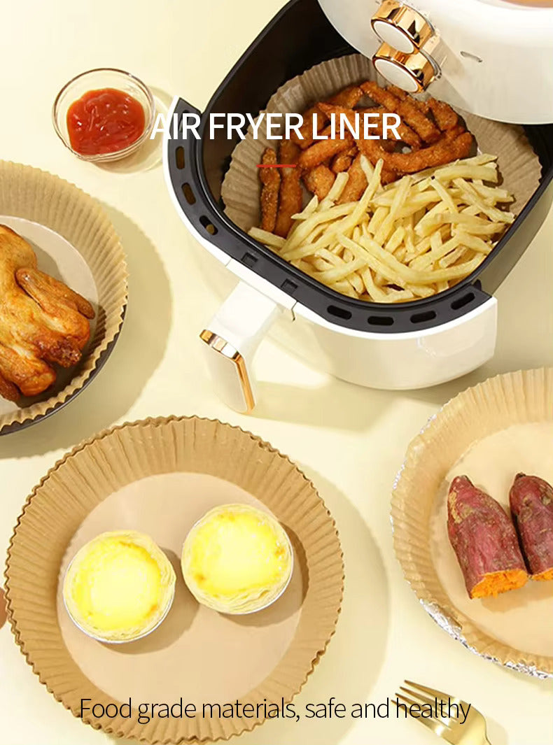 LIVSY 9 inch air fryer liners with cooked fries, chicken wings, and baked sweet potatoes in an air fryer