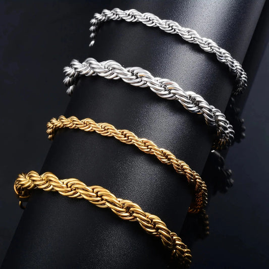 StorePilot stainless steel rope chain bracelet in silver and gold tones displayed on black stand