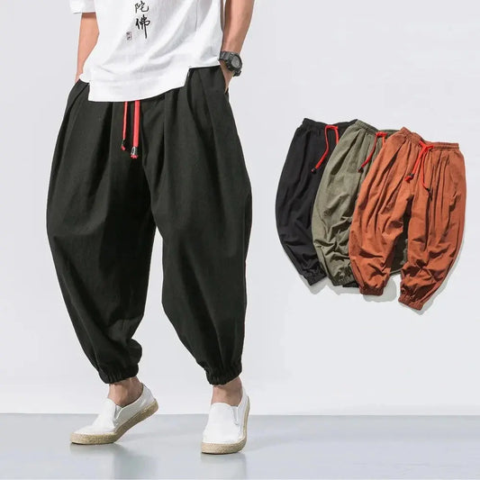 StorePilot men's harem joggers in black, olive green, and rust with elastic cuffs and red drawstrings