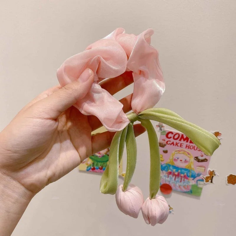 LIVSY Korean style satin scrunchies in pink with green dangling cherry design held in hand