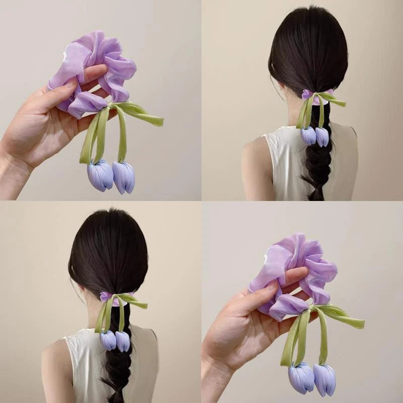 LIVSY Korean style satin scrunchies in purple with tulip flower accents worn on braided hair