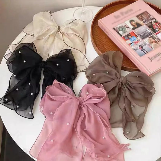 Set of LIVSY pearl bow hair clips in black white pink and brown sheer fabric with pearl details